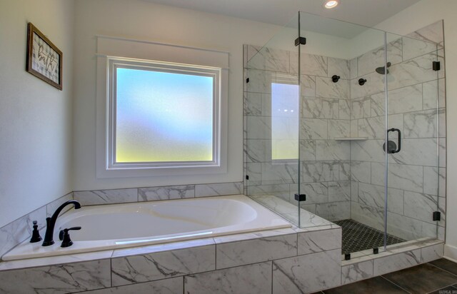 bathroom featuring separate shower and tub and tile patterned floors