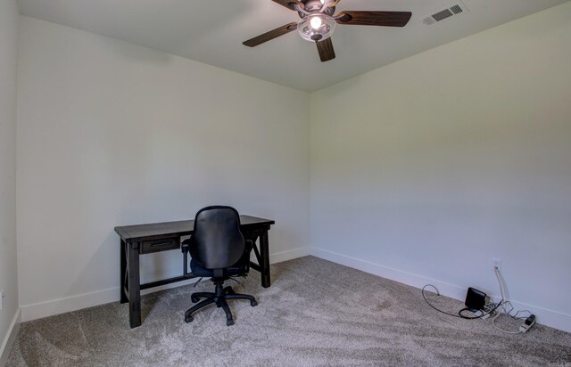 office area with ceiling fan and light carpet