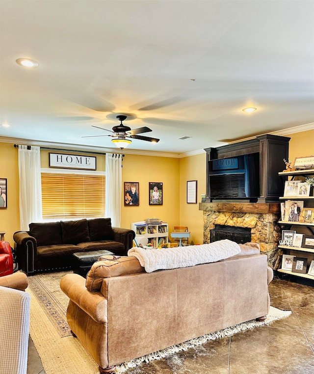 living room featuring crown molding, a stone fireplace, and ceiling fan