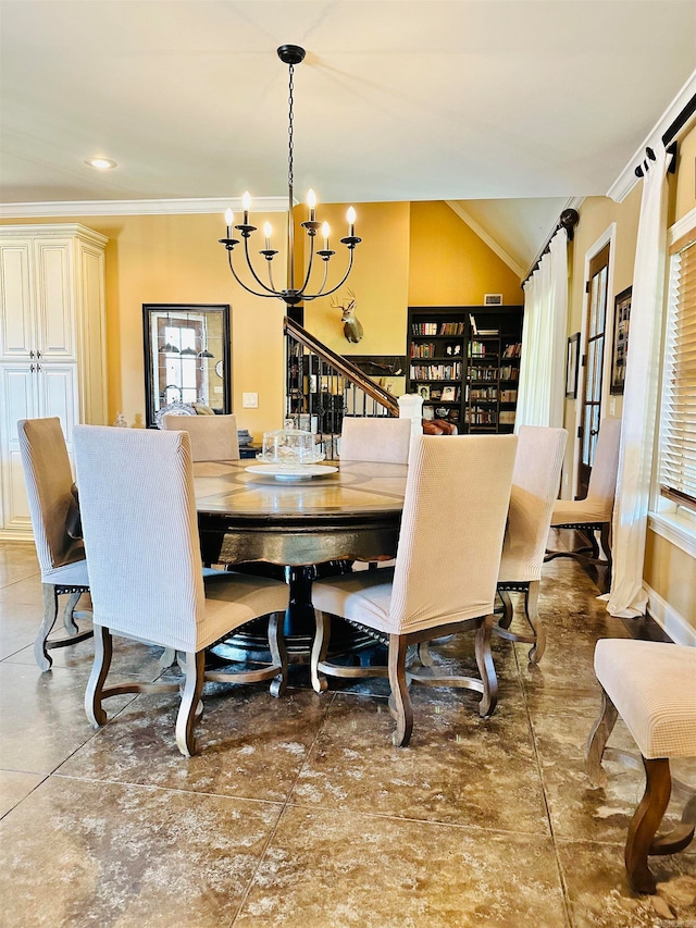 dining area featuring crown molding, a chandelier, and plenty of natural light