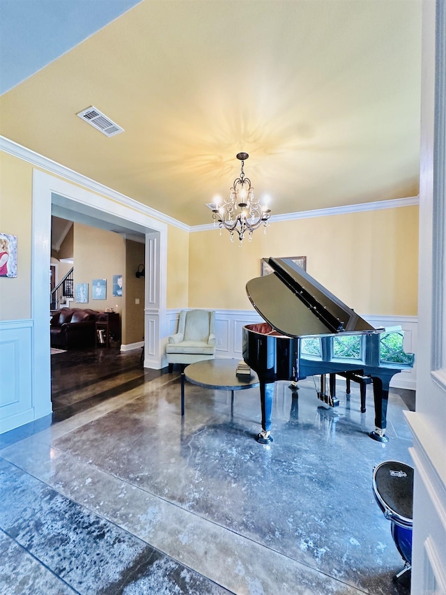 misc room with a notable chandelier and crown molding