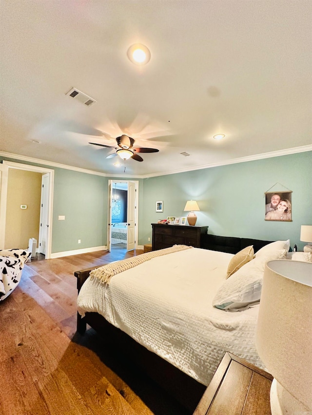 bedroom featuring ceiling fan, hardwood / wood-style flooring, and ornamental molding