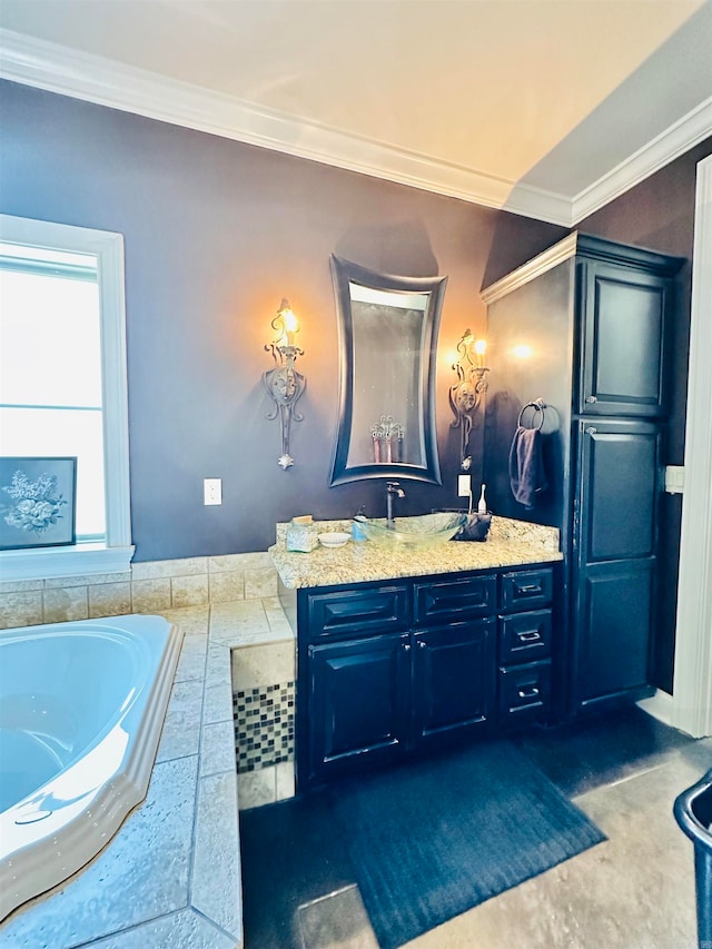 bathroom with tiled tub, vanity, and crown molding