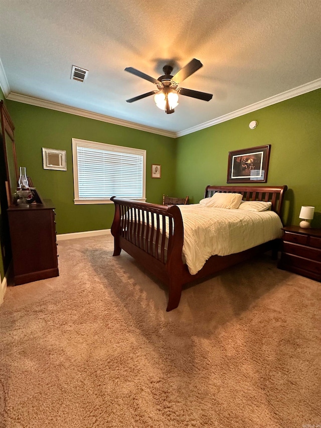 bedroom with carpet, ceiling fan, crown molding, and a textured ceiling