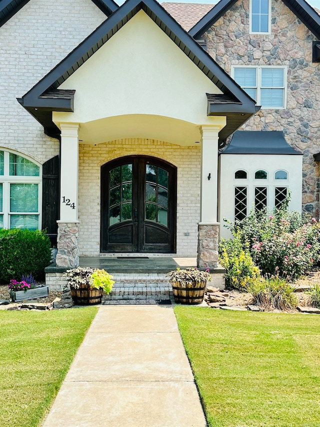 property entrance with french doors and a yard