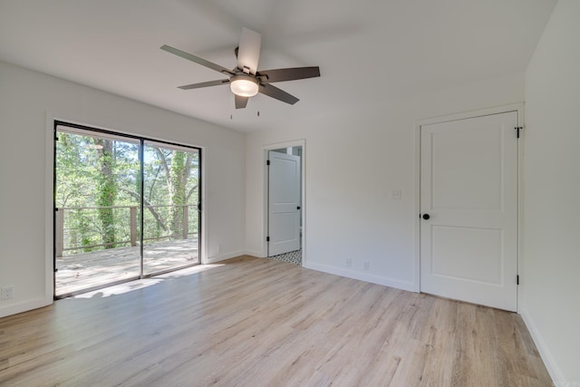 empty room featuring ceiling fan and light wood-type flooring