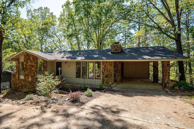 ranch-style house featuring a carport