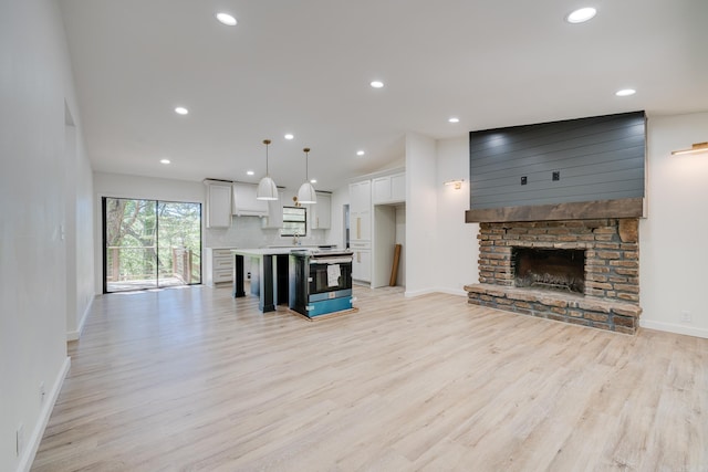 unfurnished living room with light hardwood / wood-style floors