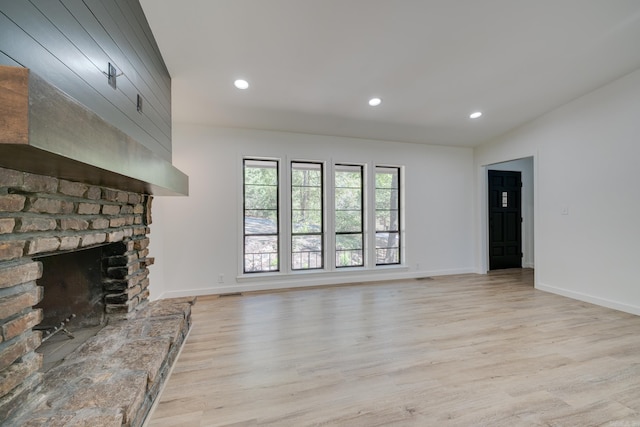 unfurnished living room featuring light hardwood / wood-style flooring