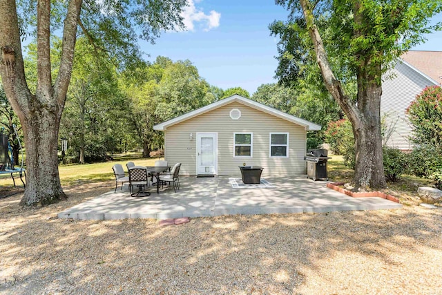 back of property with a patio area