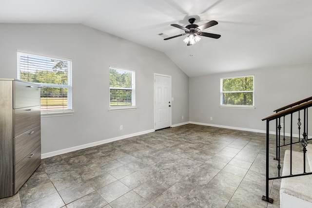 interior space featuring a healthy amount of sunlight, vaulted ceiling, and ceiling fan