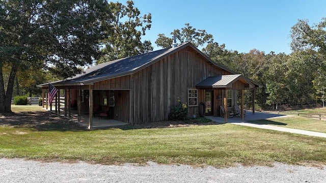 view of property exterior featuring a lawn