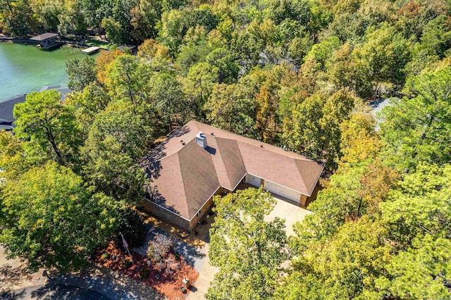 birds eye view of property featuring a view of trees