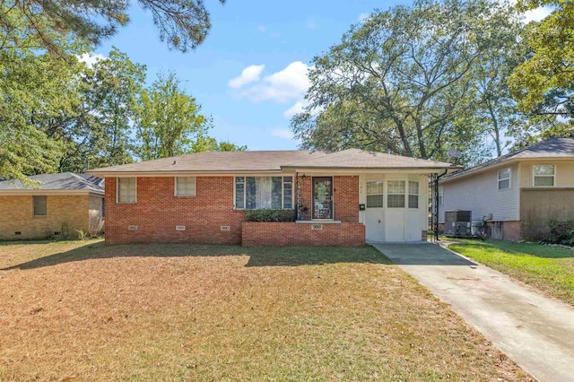 ranch-style home featuring central AC and a front lawn