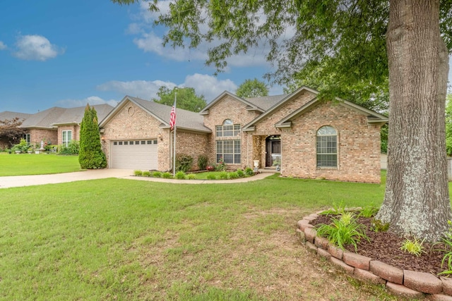 ranch-style house featuring a garage and a front lawn