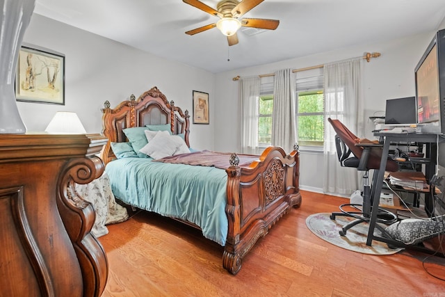 bedroom featuring light wood-type flooring and ceiling fan