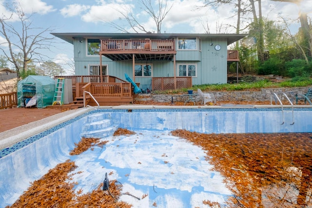 view of swimming pool featuring a deck