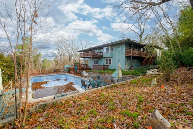 view of swimming pool featuring a deck