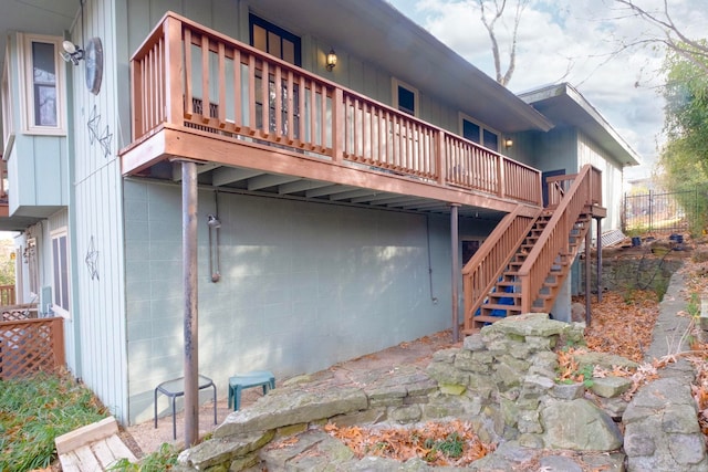 back of house featuring a wooden deck