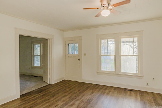 entrance foyer with crown molding, dark hardwood / wood-style flooring, and ceiling fan