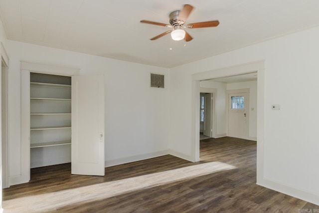 empty room with wood-type flooring and ceiling fan