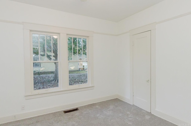 empty room featuring light carpet