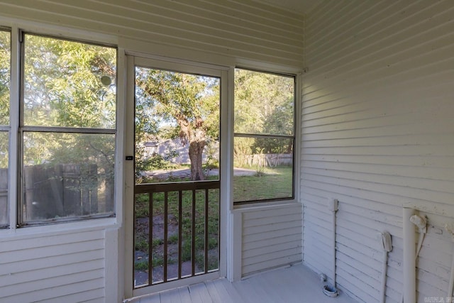 unfurnished sunroom featuring a healthy amount of sunlight