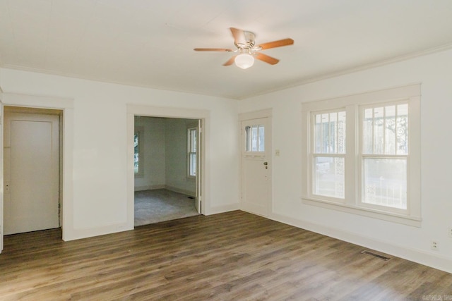 unfurnished room with ornamental molding, ceiling fan, and hardwood / wood-style flooring