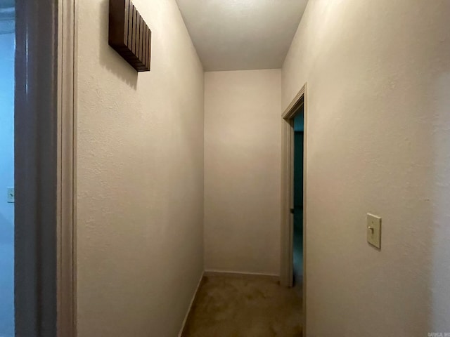 corridor with carpet flooring