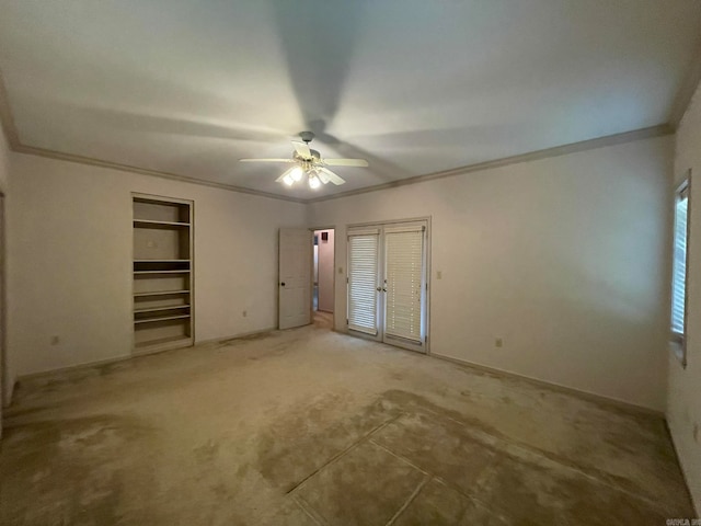 unfurnished bedroom with ceiling fan, carpet flooring, and ornamental molding