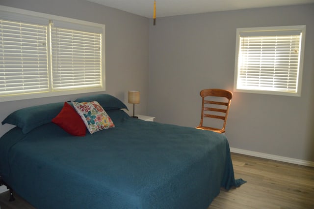 bedroom with light hardwood / wood-style flooring