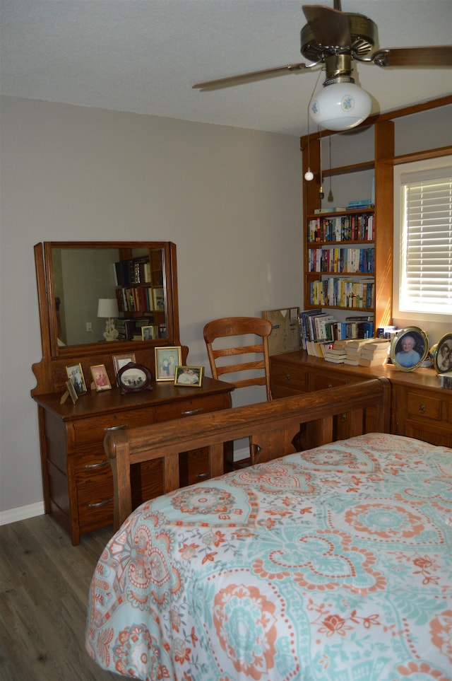 bedroom featuring wood-type flooring and ceiling fan