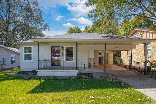 bungalow-style house with a carport, a front lawn, and covered porch