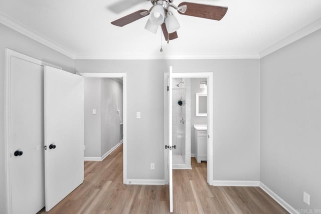 unfurnished bedroom with crown molding, light hardwood / wood-style floors, ensuite bath, and ceiling fan