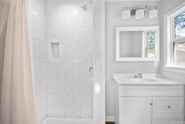 bathroom with a shower with shower curtain and vanity