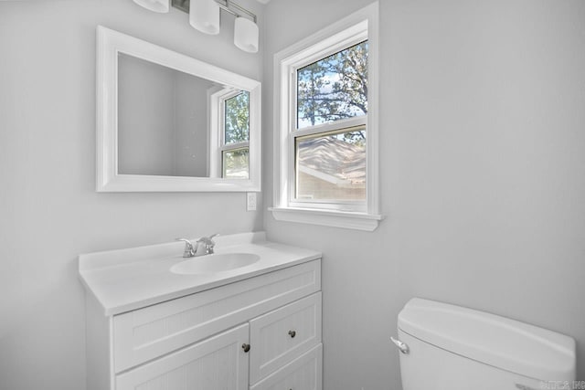 bathroom featuring vanity and toilet