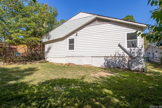 view of home's exterior with a lawn