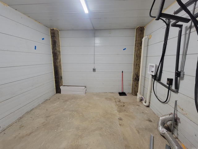 garage featuring wooden walls