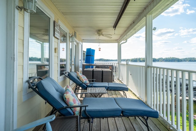 exterior space featuring a water view and ceiling fan