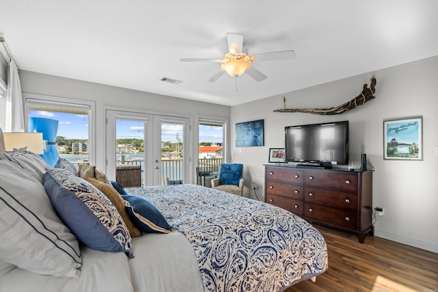 bedroom featuring french doors, dark wood-type flooring, ceiling fan, and access to outside