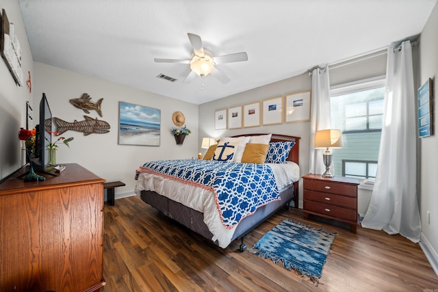 bedroom featuring ceiling fan and dark wood-type flooring