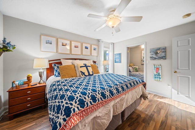 bedroom featuring dark hardwood / wood-style flooring and ceiling fan