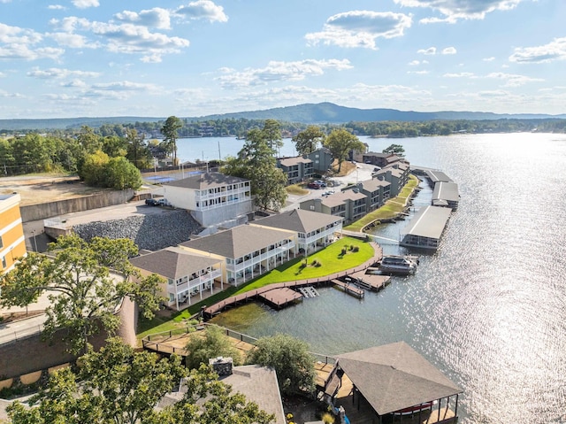 drone / aerial view featuring a water and mountain view