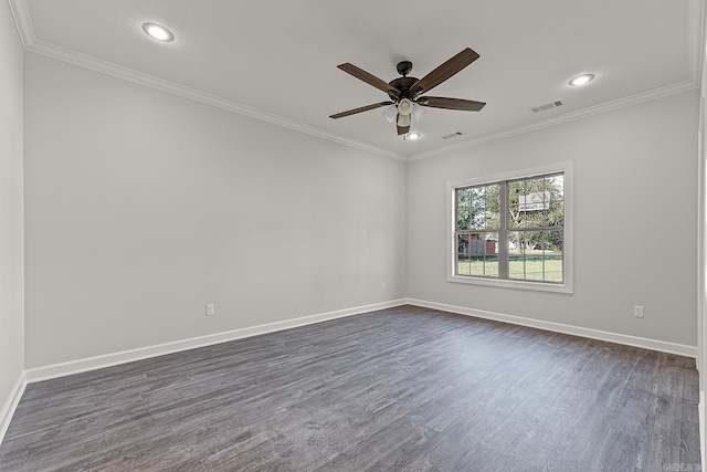 empty room featuring ceiling fan, crown molding, and dark hardwood / wood-style flooring