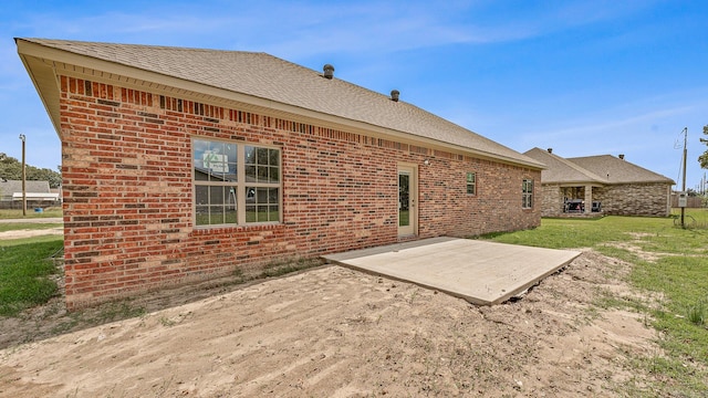 exterior space featuring a lawn and a patio