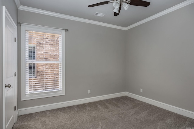 carpeted spare room with ornamental molding and ceiling fan