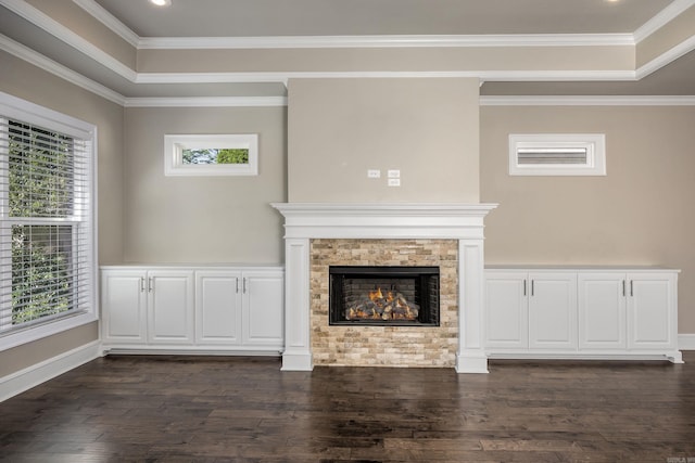 unfurnished living room with plenty of natural light, dark hardwood / wood-style flooring, and crown molding