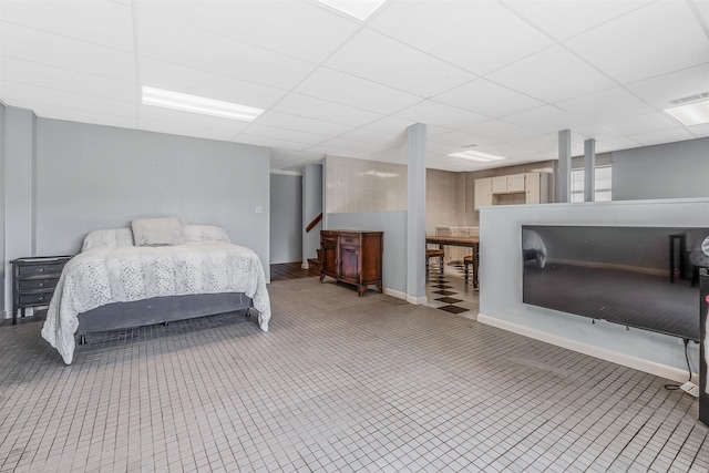 bedroom featuring a drop ceiling