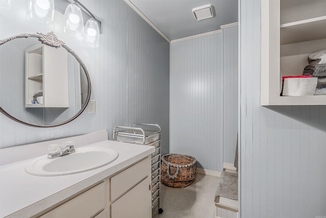 bathroom featuring ornamental molding and vanity