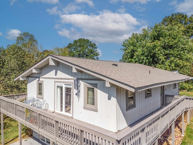 back of property with a wooden deck